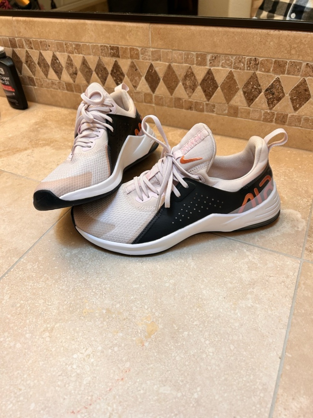 Nike Women's Pale Pink and Black Training Sneakers with Orange Accents
